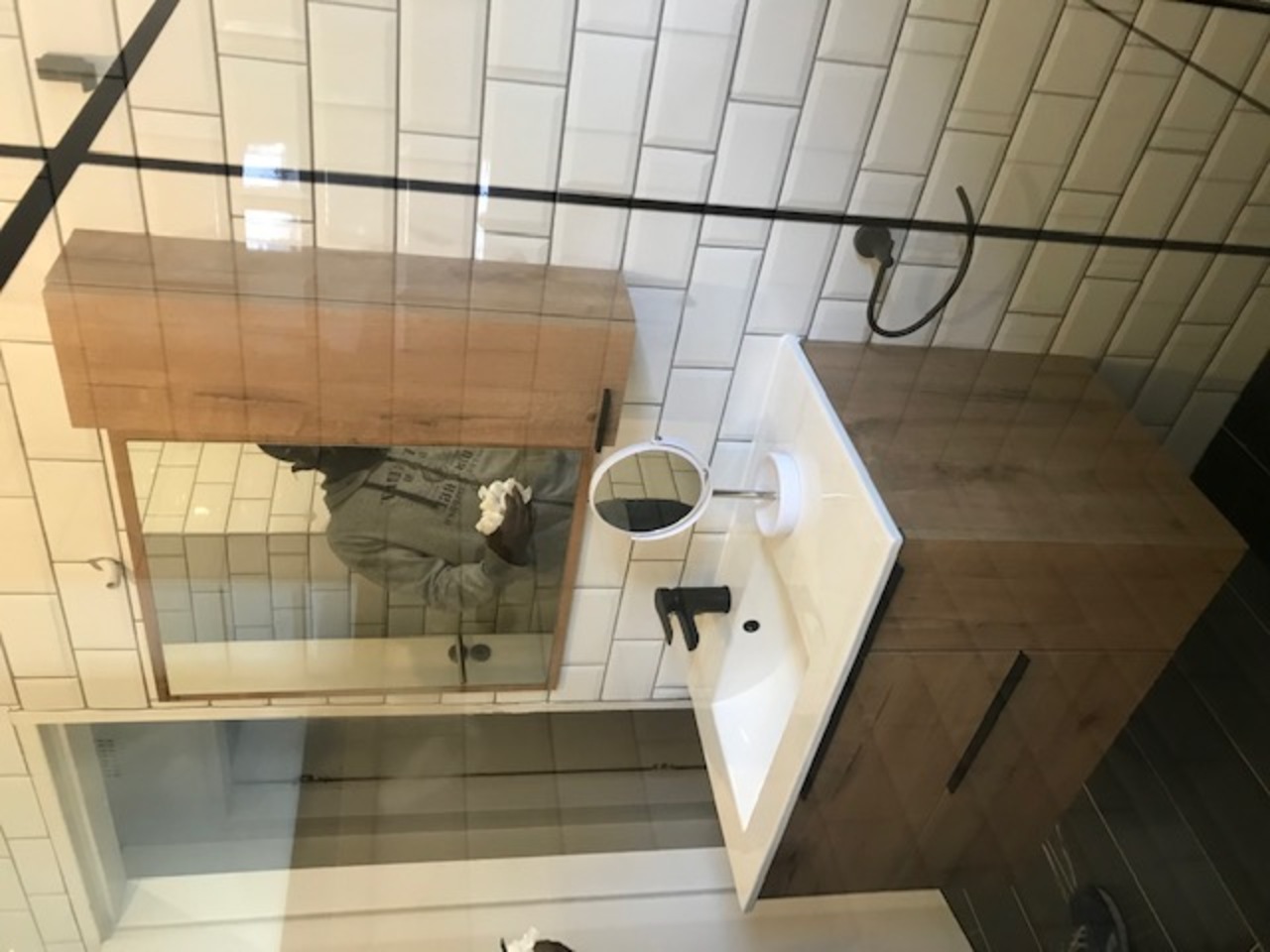 Walk-in glass shower enclosure and shower roses