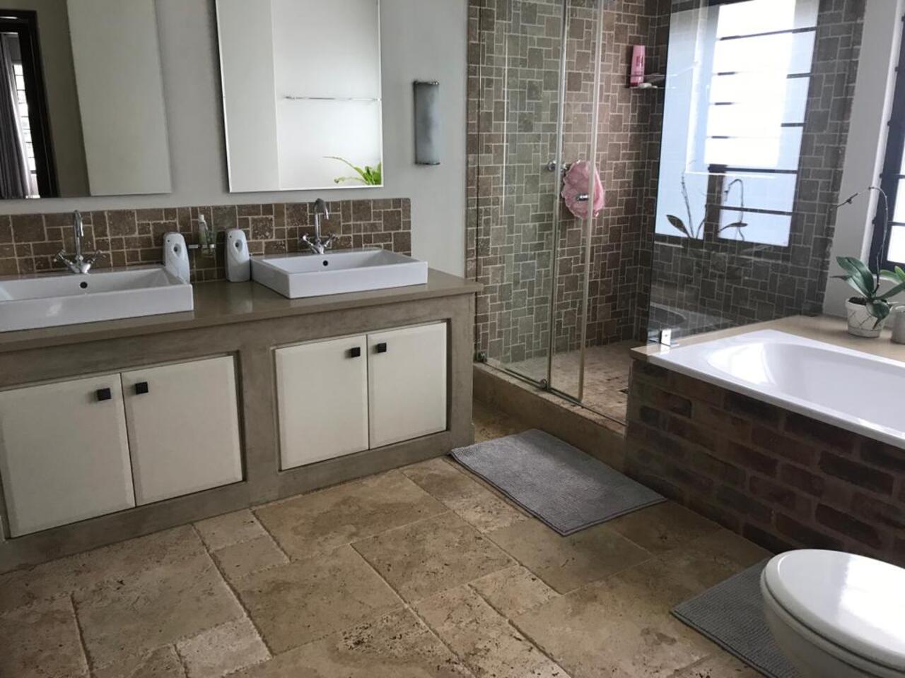 Frameless walk-in shower and mosaic tiling